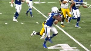 Trey-Sermon-Alex-Highsmith-stiff-arm.jpg