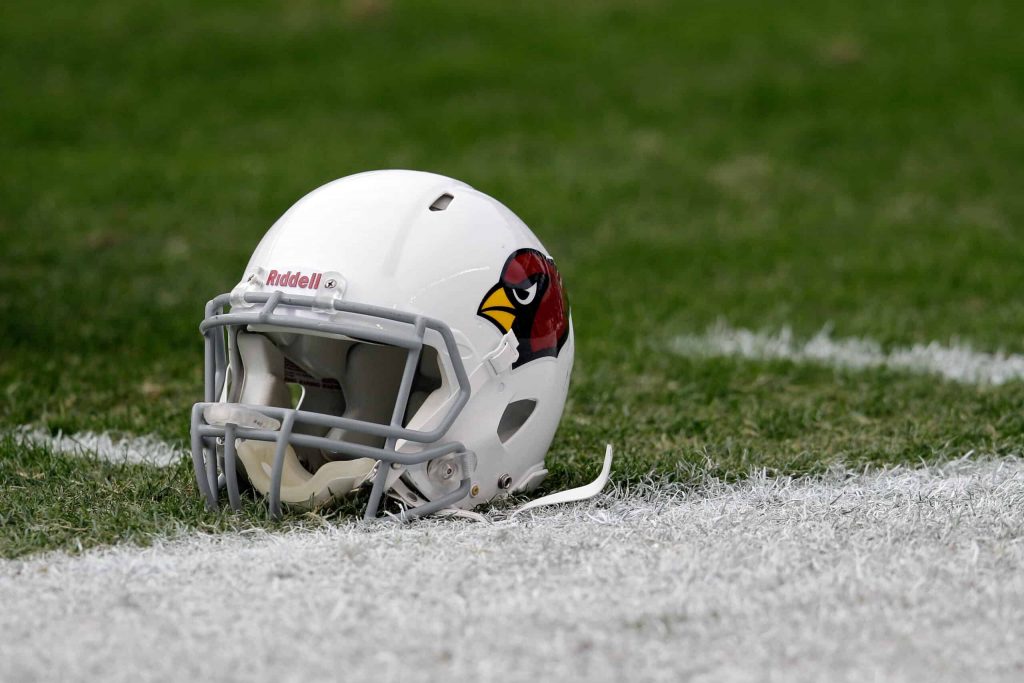 cardinals-helmet-on-field-scaled.jpg